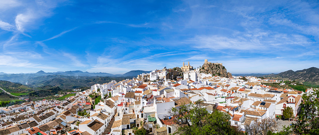 The Arab Castle and the neoclassical Encarnación Church are the two historic landmarks of Olvera, a characteristic town set atop a spur in the mountains of Cadiz (9 shots stitched)