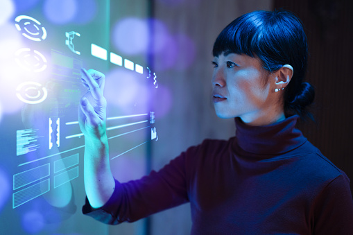 Futuristic office with Japanese mature businesswoman