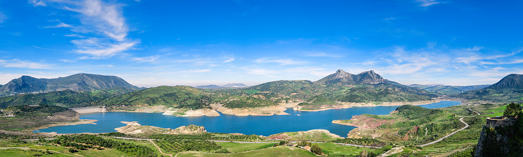 Panoramic view from Zahara de la Sierra towards the nearby reservoir and the surrounding mountains (12 shots stitched)