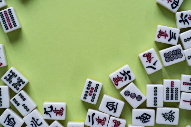 istock Mahjong tiles lined up on a green background 2072845911