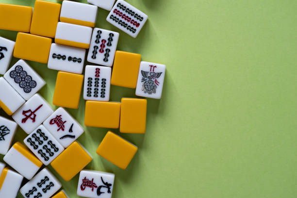 istock Mahjong tiles lined up on a green background 2072846424