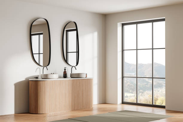 istock Beige hotel bathroom interior with double sink and accessories, window 2072850663