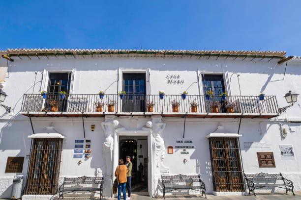 Casa Museo in Mijas, a museum in the lovely whitewashed Andalusian town (Spain) People visiting the Casa Museo, an historical and ethnographic museum located in one of the whitewashed house of Mijas, one of the most beautiful town in Andalusia mijas pueblo stock pictures, royalty-free photos & images