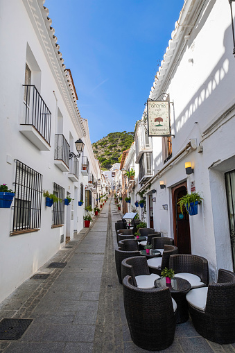 Street of Altea old town in Spain. Beautiful village with white houses and blue domed church Our Lady of Solace. Popular Spanish tourist destination in Costa Blanca region