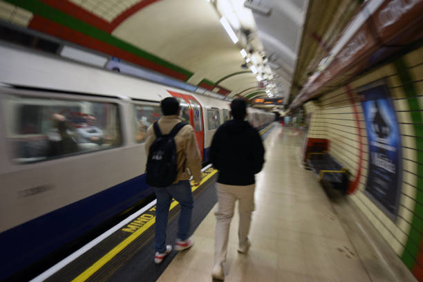 passengers in circulation inside the tunnels of the holloway road metropolitan station, London