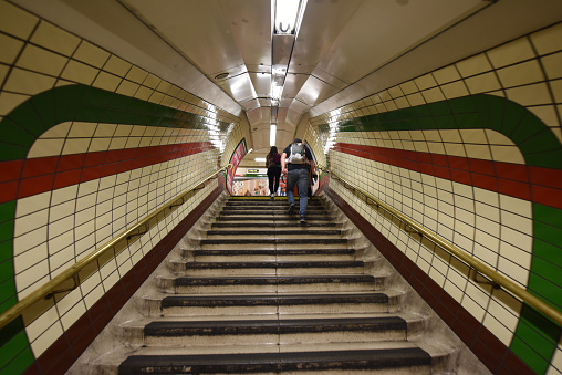 London tube tPiccadilly Circus station. The image shows a connection tunnel at the station.