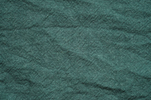 istock Green cotton fabric texture background, Wrinkle surface textile, wallpaper, banner 2072874311