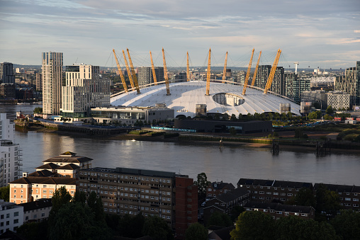 The O2 Arena, commonly known as The O2, is a multi-purpose indoor arena in the centre of The O2 entertainment district on the Greenwich Peninsula in southeast London. The image shows the arena captured during summer season.