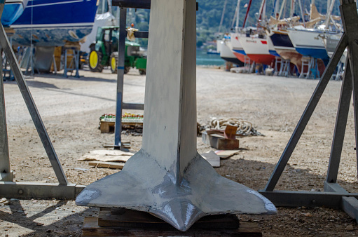 Wing keel of the sailing yacht. Boat repair in dry dock.
