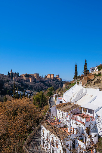 The Alhambra of Granada as seen from the neighborhood of Sacromonte. The palace is the most famous landmark of the city and a monument of the Islamic architecture in the world.