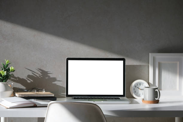 istock Workplace comfortable with computer laptop, coffee cup, notebook, picture frame and flower pot. 2072924623