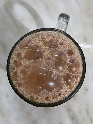 Tea with milk or popularly known as Teh Tarik in Malaysia. Top view