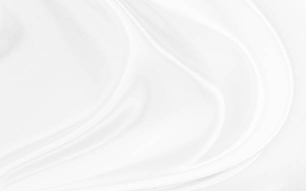 istock White gray satin texture that is white silver fabric silk background with beautiful soft blur pattern natural. 2072954376
