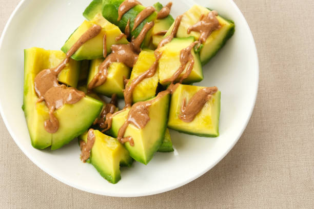 avocado with almond butter - carbohydrate freshness food and drink studio shot стоковые фото и изображения