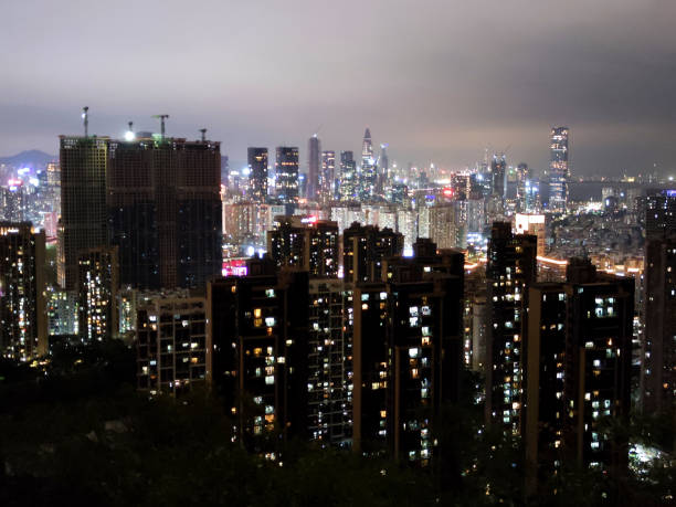 Shenzhen Cityscape at night, viewed from Nanshan mountain, a mountain range in Shenzhen, located at the southern tip of Nanshan District, itself named after the mountains. Guangdong province, China