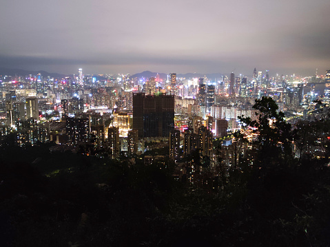 Shenzhen Cityscape at night, viewed from Nanshan mountain, a mountain range in Shenzhen, located at the southern tip of Nanshan District, itself named after the mountains. Guangdong province, China