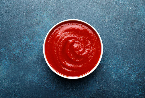 Tomato paste, sauce, ketchup with copy space , top view