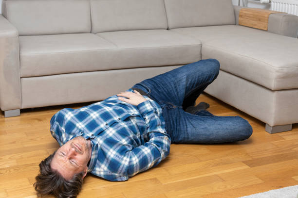 istock Men after fall on a floor and touching his hip 2073086918