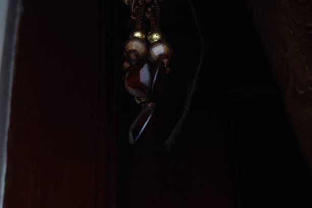 The curtain accessories with shiny brown crystal tassels and abstract shapes are very luxurious and elegant