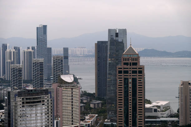 Skyline on Shenzhen bay, viewed from Nanshan mountain, a mountain range in Shenzhen located at the southern tip of Nanshan District, itself named after the mountains. Guangdong province, China