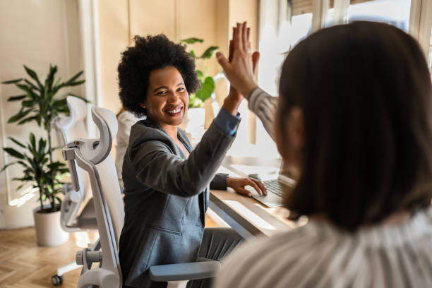 istock Businesswoman high five 2073153315