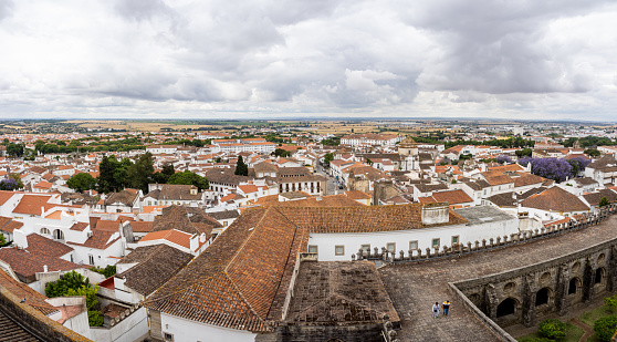 Panoramic view over the city of Évora and the Alentejo region. With the cloister of Évora Cathedral in the foreground. Portugal.