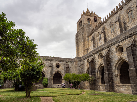 View of the magnificent Gothic cloister of the largest medieval cathedral in Portugal, Évora Cathedral. In the background the bells placed in the south tower.
