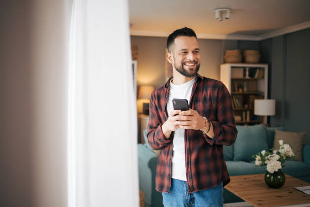 istock An adult man is using his smartphone. 2073196739