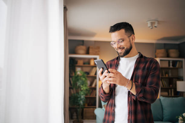 istock An adult man is using his smartphone. 2073197784