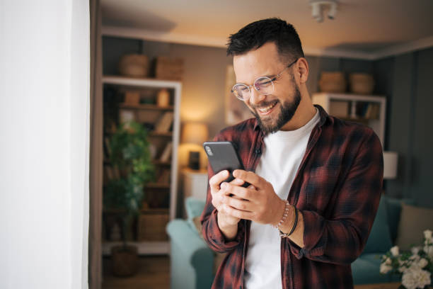 istock An adult man is using his smartphone. 2073198802