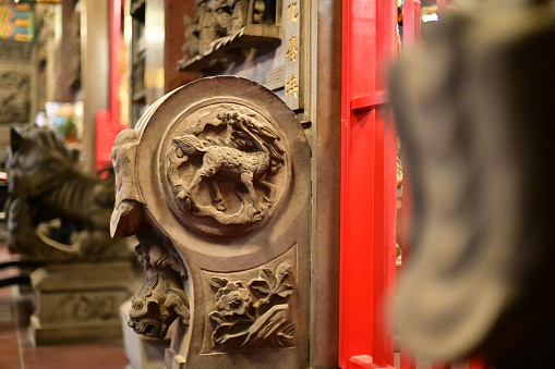 Taiwan - Jan 23, 2024: A pair of elaborately carved stone drums flank the entrance to Songshan Ciyou Temple, a renowned Taoist temple in Taipei, Taiwan, symbolizing auspiciousness and prosperity.