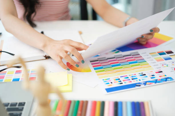 istock Creative woman selection colour in colour swatch samples, working on new project at desk. 2073239483