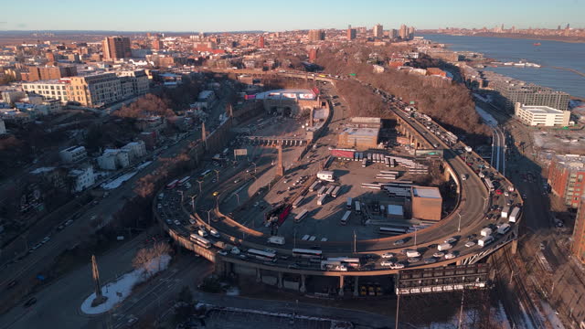 Transportation on Lincoln Tunnel exit in Weehawken, New Jersey on the waterfront of the Hudson River in the afternoon. Aerial footage with static camera motion