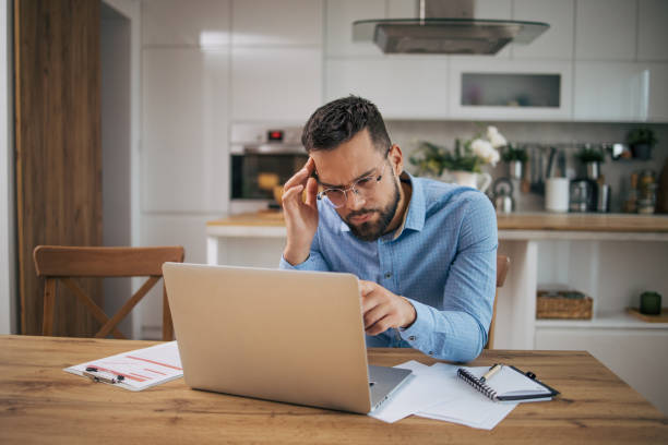 istock A businessman works from home and is annoyed. 2073248218