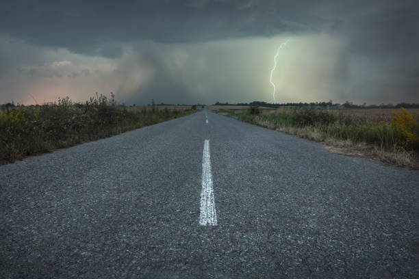 istock An empty road to meet the ominous summer storm 2073293282