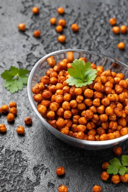 istock Roasted spicy chickpeas in bowl. Healthy snack. 2073337447