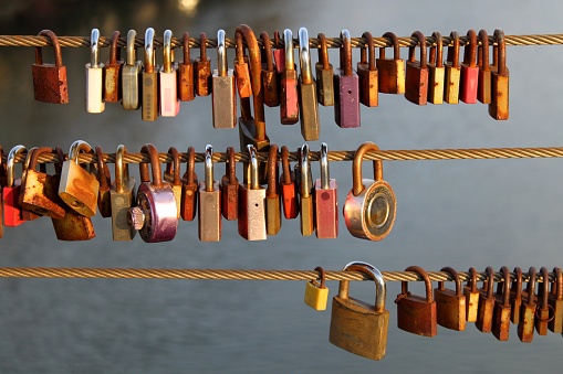 Numerous love locks on the bridge railings, a symbol of eternal love.\nBamberg, Bavaria, Germany