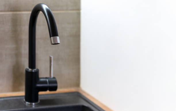 istock Black kitchen water tap without water. Lack of water. 2073363665