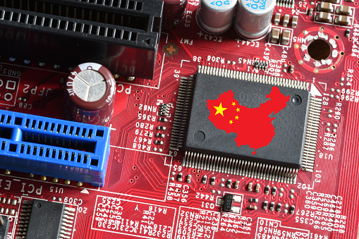 Map and Flag of the Republic of China on microchip of a printed electronic card. Concept for supremacy in global microchip and semiconductor manufacturing.