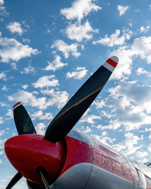 Props on an airplane against a cloudy sky