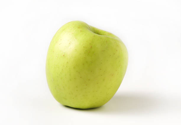 Ripe apples arranged on a white tray. Side view. Juicy fruits that are rich in vitamins, ideal for healthy eating content.