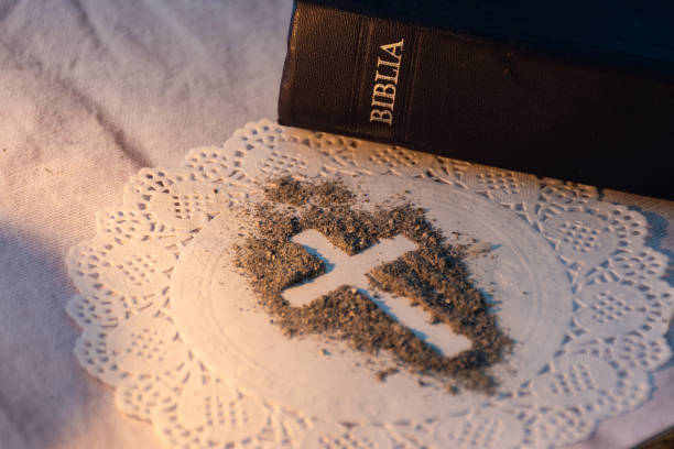 istock Cross in ash and holy bible 2073399476