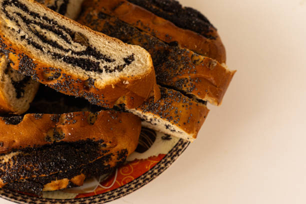 istock pieces of roll with poppy seeds on a plate 2073401535