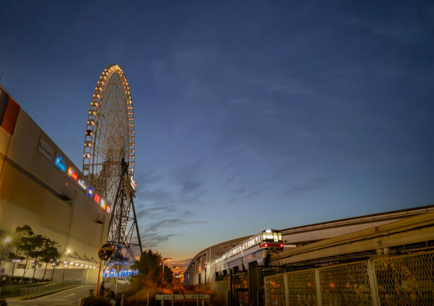 Osaka, Japan - Jan 30, 2024: Osaka Monorail and Redhorse Osaka Wheel in the evening