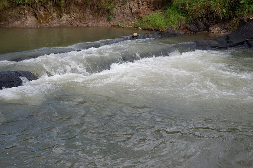 Photography of The flow of water flowing in a river is suitable for a natural background