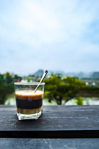 Vietnamese Style Drip Coffee with Condense Milk, close-up in Vietnam