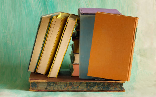 Stack of books with blurred background, reading, learning, education ,knowledge is poqwer or home office concept