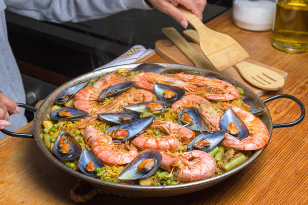 istock A traditional Spanish paella with shrimp and mussels in a rustic kitchen setup, typical Spanish cuisine, Majorca, Balearic Islands, Spain 2073513676