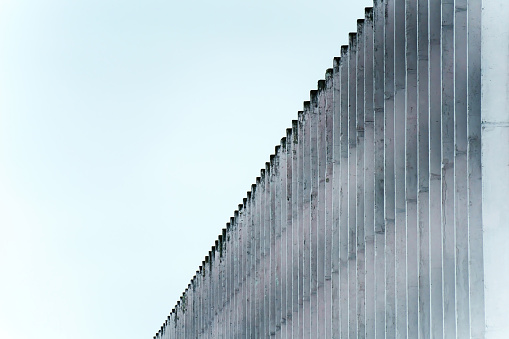 Vertical Concrete Block Wall Overcast Sky