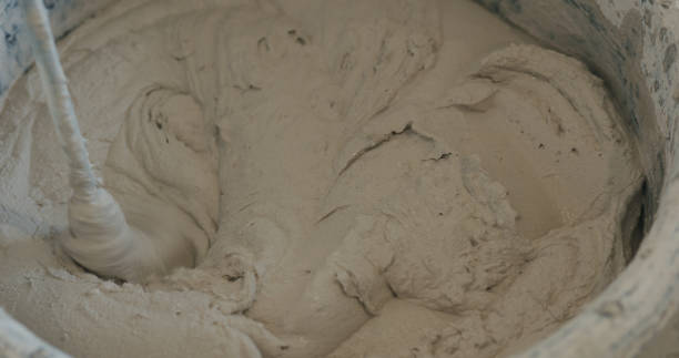 istock mixing concrete plaster with electric mixer 2073521685
